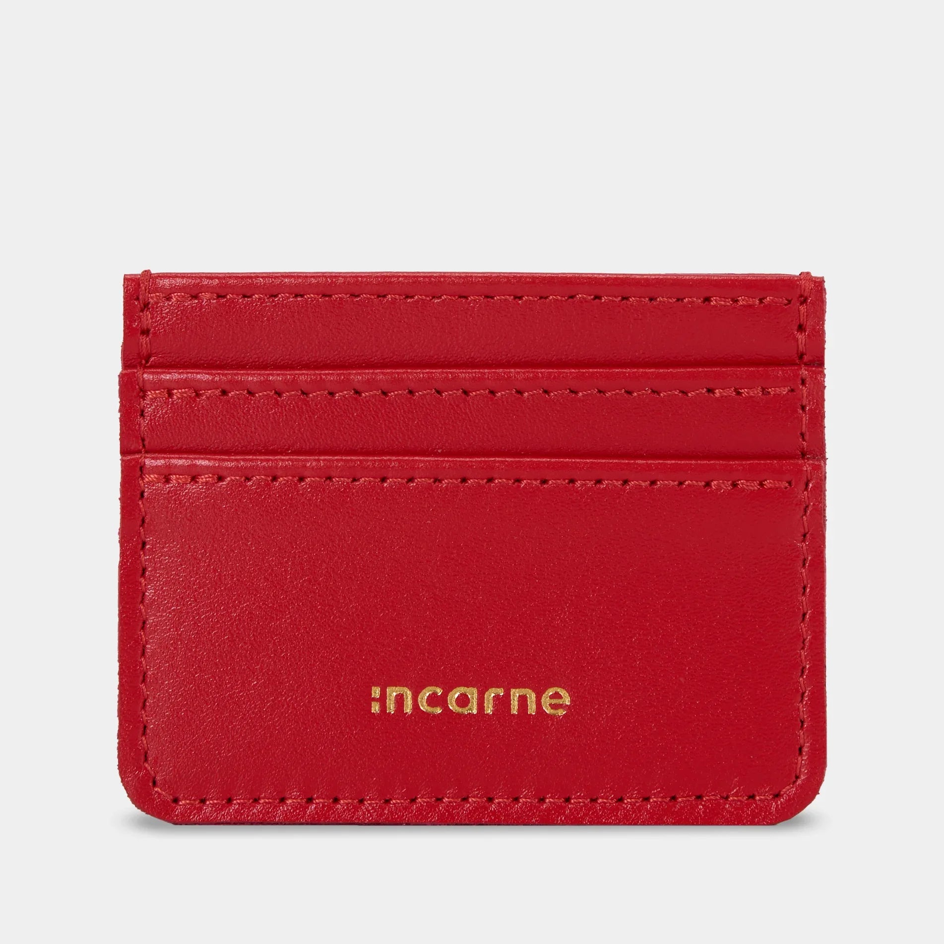 Червоний шкіряний кардхолдер Minimal від INCARNE на білому тлі, мінімалістичний жіночий та чоловічий аксесуар для карток
