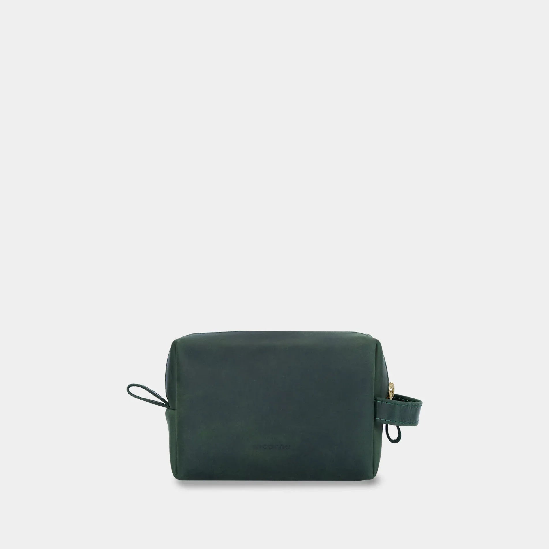 Косметичка Mirage у зеленому кольорі, зручно лежить у руці завдяки міцній боковій ручці зі шкіри